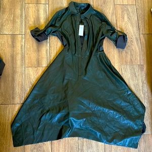 This lovely dark green dress is in a extra small and it’s leather .Never worn